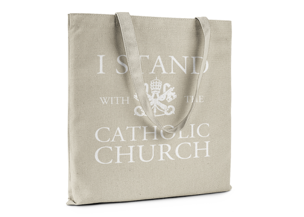 Natural color tote bag that reads I Stand With The Catholic Church.