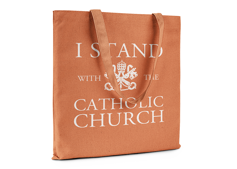 Orange tote bag that reads I Stand With The Catholic Church.