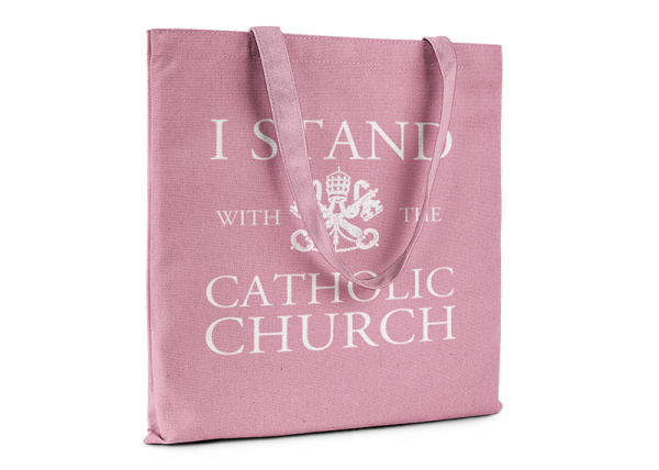 Pink tote bag that reads I Stand With The Catholic Church.