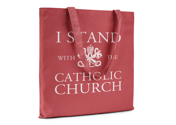Red tote bag that reads I Stand With The Catholic Church.