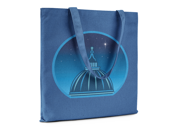 Royal blue tote bag printed with a graphic of a cathedral cupola against a starry night sky.