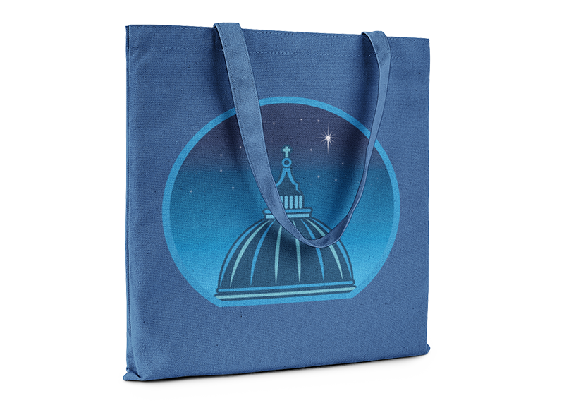Royal blue tote bag printed with a graphic of a cathedral cupola against a starry night sky.